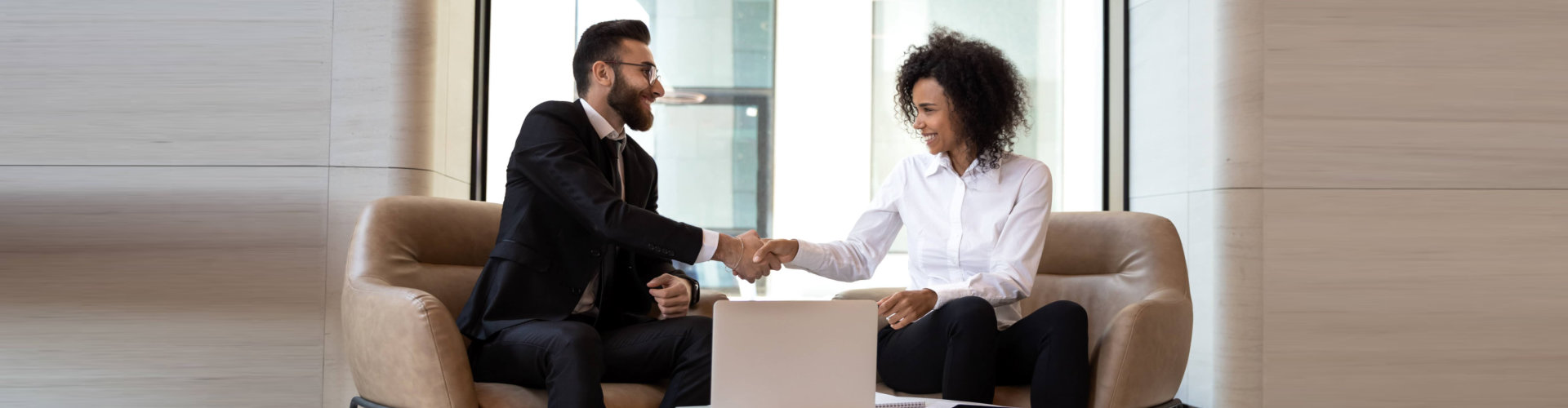 man and woman shakehands